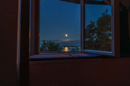 Gorgeous view of sunset trough open window. Sweden.の写真素材