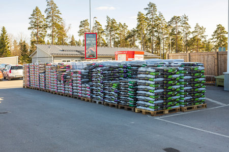 Close up view of plastic bags with planting soil outside ICA local boutique. Europe. Sweden....