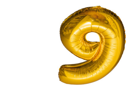 Close up view of balloon in form of number nine isolated on white background