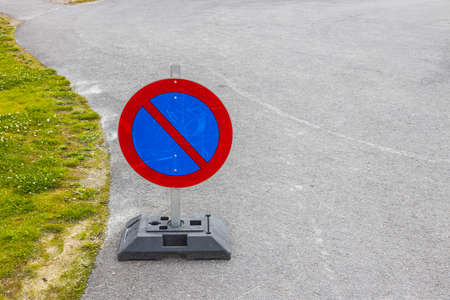 Close up view of temporary traffic sign on asphalt road. Sweden.の写真素材