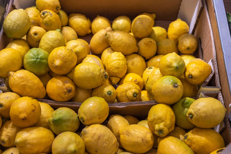 Close up view of lemons on a shelf of supermarket. Sweden.