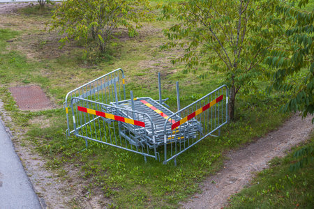 Metal facing part gathered on side of road. Renovation work and safety concept. Sweden.