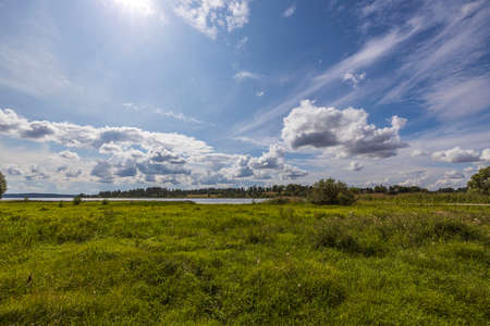 Beautiful landscape view on summer day on blue sky with white clouds background. Sweden.の写真素材