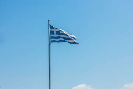 Close up view of Greece flag on blue sky background. Greece.の写真素材