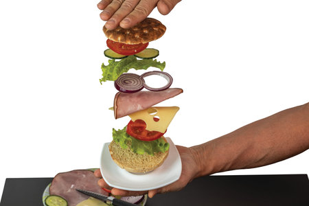 Beautiful view of homemade meat sandwich with flying ingredients isolated on white background. Sweden.の写真素材