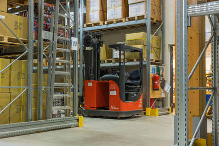 View of storage warehouse. Fork lift truck in warehouse store. 11.24.2021. Enkoping. Sweden.のeditorial素材