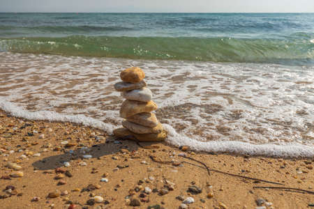 Beautiful view of waves oncoming on composition of stones. Greece.の写真素材