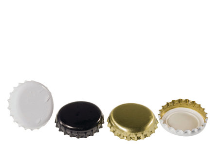 Close up view of four different black and white metal caps with drops isolated on white background.