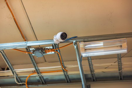 Close up view of modern surveillance safety camera under ceiling. security concept. Sweden.