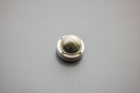 Close up view of outdoor public safety surveillance camera on gray wall. Sweden.の写真素材