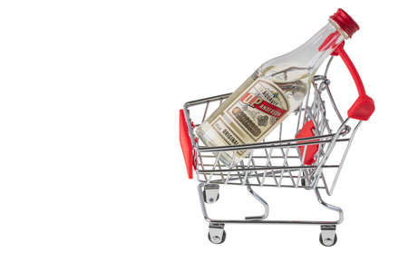 Close up view of bottle vodka in trolley isolated on white background. Unhealthy food concept. Sweden. uppsala. 03.21.2022.のeditorial素材
