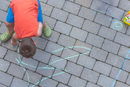Beautiful top-down view from as child draws on paving slabs. Sweden.の写真素材