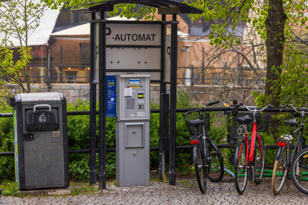 Cityscape background. City car parking equipped with automatic payment machine, garbage container...