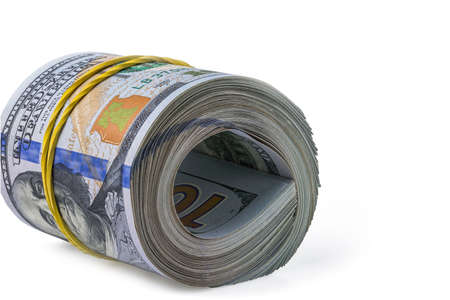 Close up view of stack of 100 dollar bills rolled into roll isolated on white background.の写真素材
