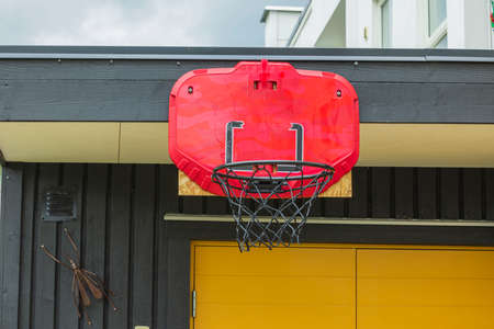 Close up view of basketball hoop with net mounted on wooden wall. Sweden.の写真素材
