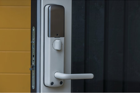 Close up view of modern white entrance door with digital lock.