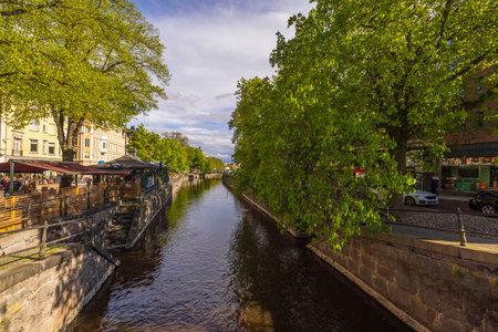 Beautiful view of the riverfront in Uppsala city center with outdoor restaurants and cafes. Sweden. Europe. uppsala. 09.20.2022.のeditorial素材