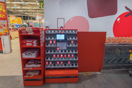 Interior view of ICA supermarket. Stand with customer scanners and grocery shopping bags. Sweden. uppsala. 12.14.2022.のeditorial素材