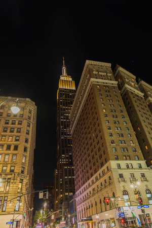 Beautiful night view of from 34th Street on Empire State Building between buildings. New York, Manhattan, USA. 09.22.2022.のeditorial素材