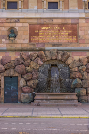 Exterior of Royal Palace in the center of Stockholm, with artificial fountain on facade of building. Sweden. Stockholm. 07.18.2022.のeditorial素材