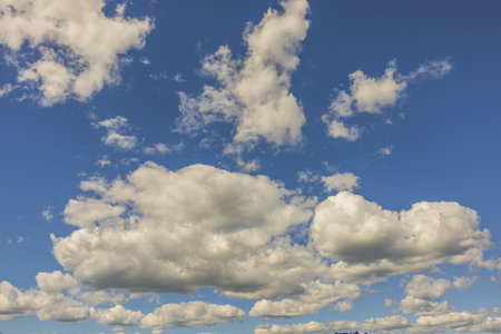 Beautiful view of puffy white clouds on blue sky background. Beautiful nature background concept.の写真素材