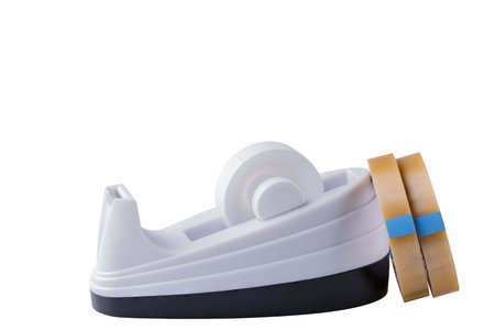 Close up view of tape holder and two refills of tape isolated on white background. stationery concept.の写真素材