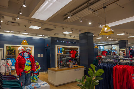 Close up view of interior with clothing Tommy Hilfiger section of department store Macy's. new york....