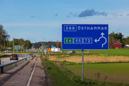 Close up view of motorway with road billboard with screen. Sweden. uppsala. 08.25.2022.のeditorial素材