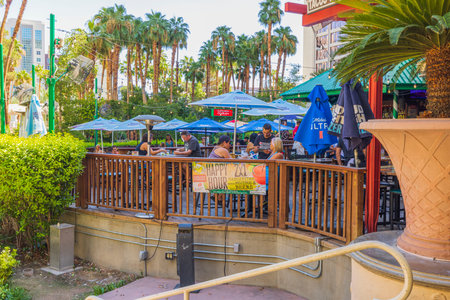 Beautiful view of tourists having breakfast at outdoor hotel restaurant. Las Vegas. USA. 09.15.2022.のeditorial素材