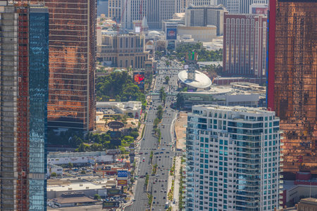 Beautiful top view of skyscrapers casino hotels in Las Vegas on Strip with moving cars on road. Las Vegas. USA. 09.17.2022.のeditorial素材