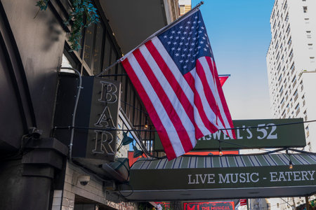 Close-up view of American flag on building of theater on Broadway. new york. USA. 09.22.2022.のeditorial素材