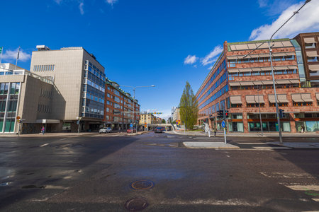 Beautiful cityscape view of downtown in bright spring day. Wet asphalt roads after rain. Sweden. uppsala. 05.14.2022.のeditorial素材