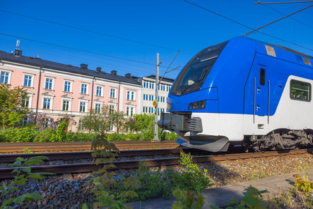Close up view of speed electric train passing in town. Sweden. Europe.の写真素材