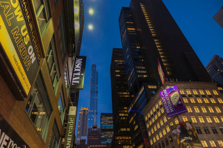 Gorgeous up view of colorful illuminated skyscrapers on dark sky background. Manhattan. New York, USA. 09.22.2022.のeditorial素材