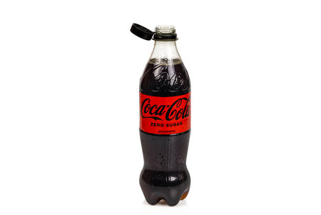 Close up view of plastic bottle of Sugar Free Coca Cola with open cap holding onto neck of bottle. Sweden. uppsala. 04.10.2023.のeditorial素材