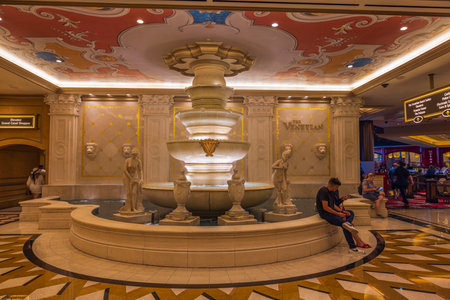 Beautiful interior view of Venetian hotel with people sitting near fountain. Strip, Las Vegas, Nevada, USA. 09.17.2022.のeditorial素材