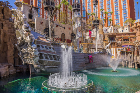 Beautiful view of the territory of Treasure Island hotel on Strip with fountains in pond and pirate ship. Las Vegas. USA. 09.17.2022.のeditorial素材