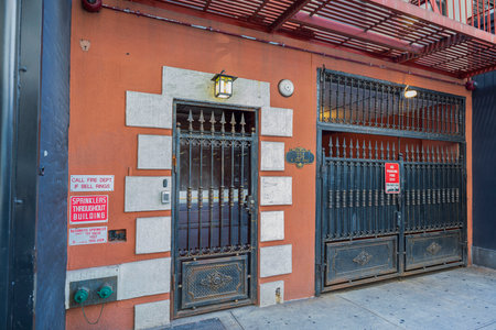 Close-up view of metal grind on building entrance and portal. New York city, USA. 09.21.2022.のeditorial素材