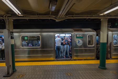 Close-up view of passengers with open train doors at Astor place station of New York City Subway. NY. USA. 04.24.2023.のeditorial素材
