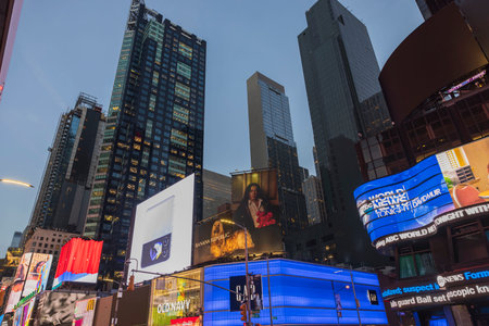 Gorgeous evening view of skyscrapers on Broadway with advertising LED panels. New York. USA. 09.22.2022.のeditorial素材