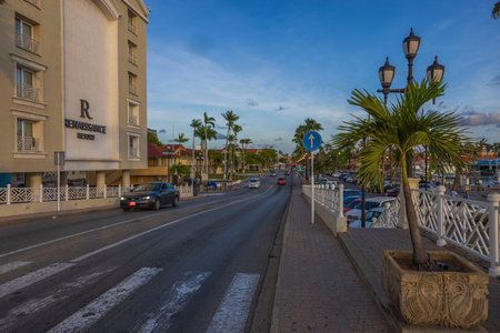 View of main street of Oranjestad with passing cars in front of Renaissance hotel. Aruba. Oranjestad.のeditorial素材