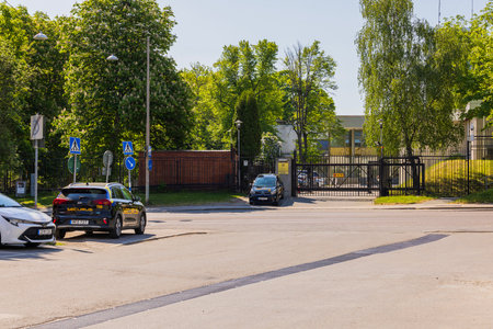 View of security cars in front of entrance to Russian Embassy metal fence. Stockholm, Sweden.のeditorial素材
