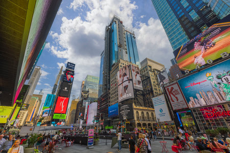 Panoramic view of people surrounded with skyscrapers on Broadway, Manhattan, New York.のeditorial素材