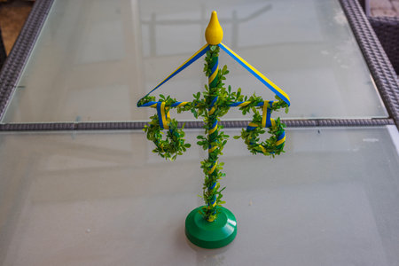 Beautiful view of traditional Swedish table decoration for Midsummer holiday on table background.の写真素材