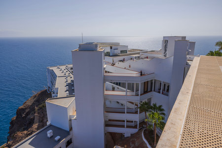 Beautiful view of RIU hotel building on top of mountain on backdrop of Atlantic Ocean. Gran Canaria. Spain.のeditorial素材