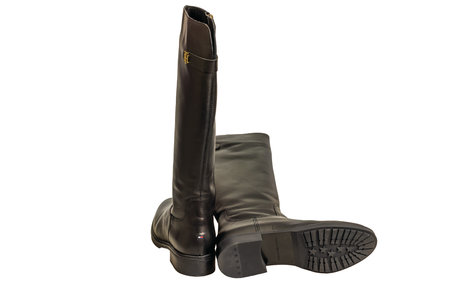 Close-up view of black leather knee-high Tommy Hilfiger boots isolated on white background.のeditorial素材
