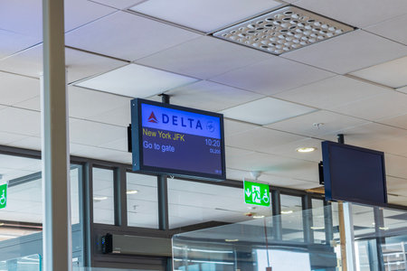 Beautiful view of parked Delta Airlines jet connected to boarding bridge at John F. Kennedy Airport in New York. USA.のeditorial素材
