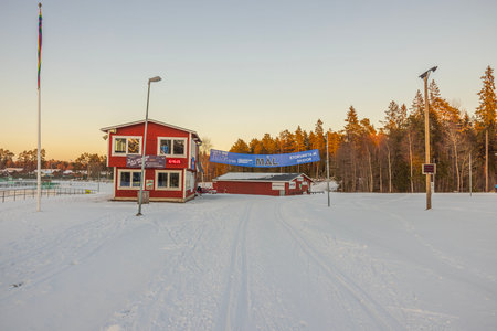 View of winter landscape with ski tracks and building of ski sports club.のeditorial素材