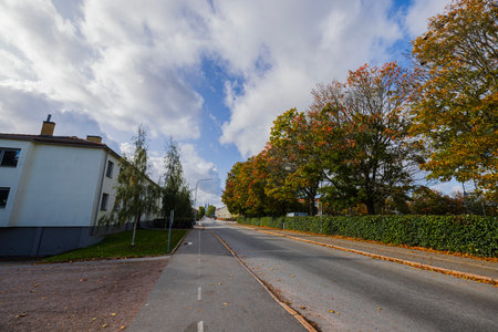 Beautiful autumn landscape of one of central streets of city Uppsala in Swedenの写真素材