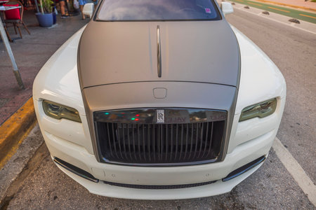 Close-up front view of beige-gray luxury car ROLLS-ROYCE. Miami Beach. USA.